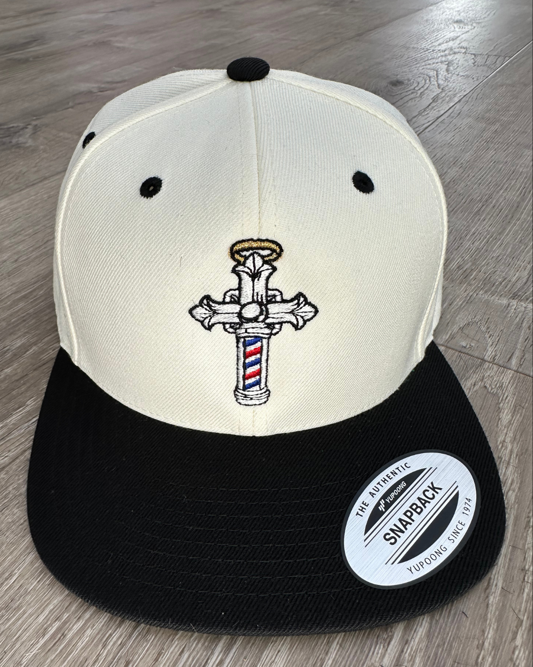 The Christian Barber Cross Logo Snapback Hat – Black & Cream Faith-Based Cap